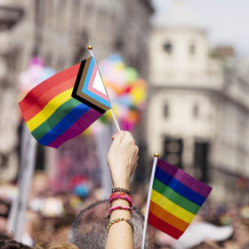 Medoore Progress Pride flag in hand, lightweight and portable