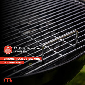 Megamaster 22in charcoal grill cooking area ready for burgers and veggies.