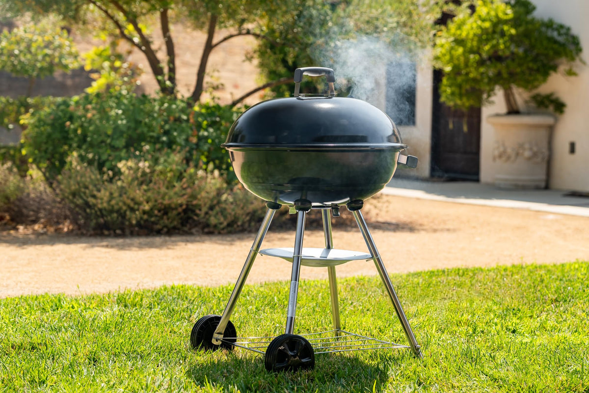 Megamaster 22in grill with two wheels for portable outdoor cooking on the go.