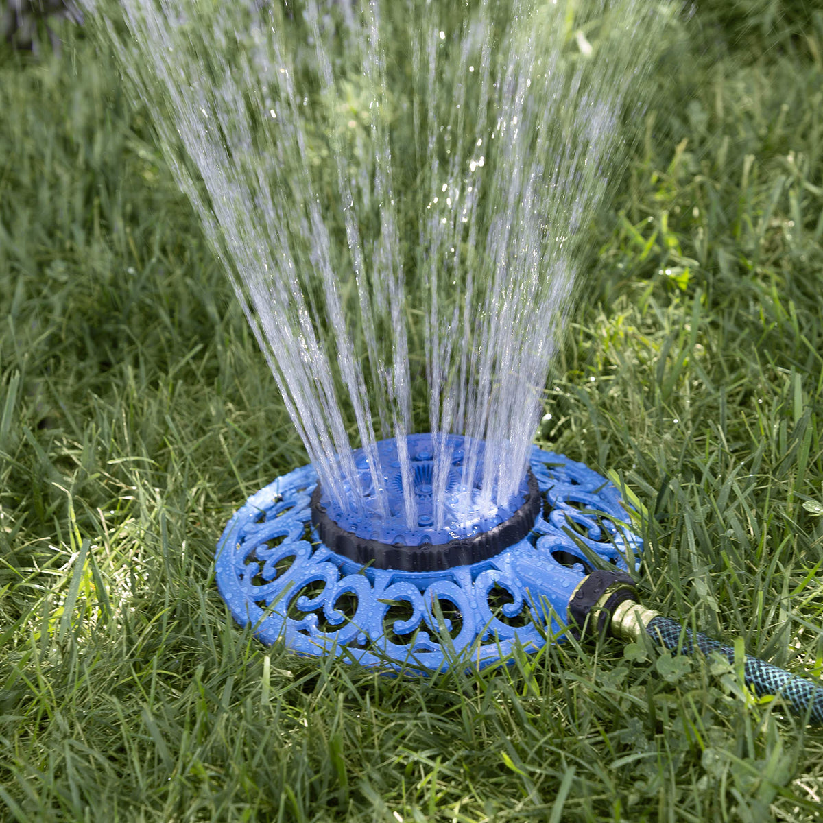 Melnor Sprout decorative metal base provides stable watering on uneven ground.