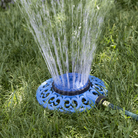 Melnor Sprout decorative metal base provides stable watering on uneven ground.