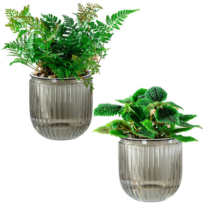 Melphoe self-watering pot outer with reservoir keeps soil moist.