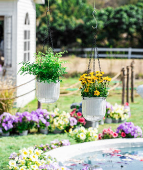 Melphoe outdoor white hanging plant basket with visible water level.