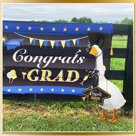 Memorywuu Goose outfit with cap highlights playful graduation attire on a lawn goose.