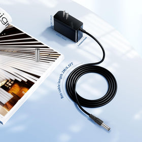 MEROM compact black power adapter designed for easy storage