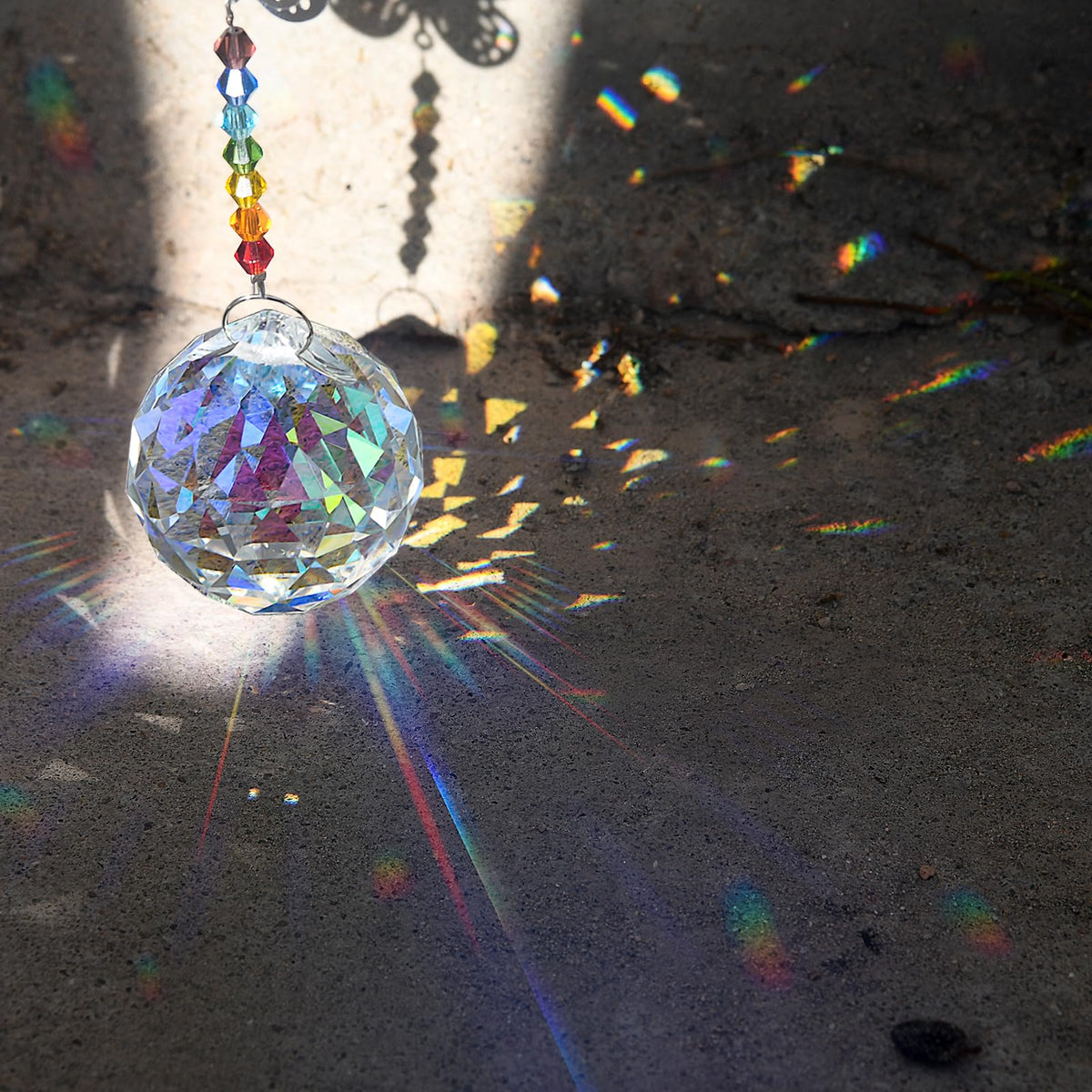 MerryNine feng-shui crystal prism 30mm enhances sunlight with balanced color reflections.