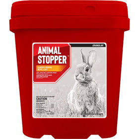 Messinas Animal Stopper Granular being poured to protect a garden bed from pests