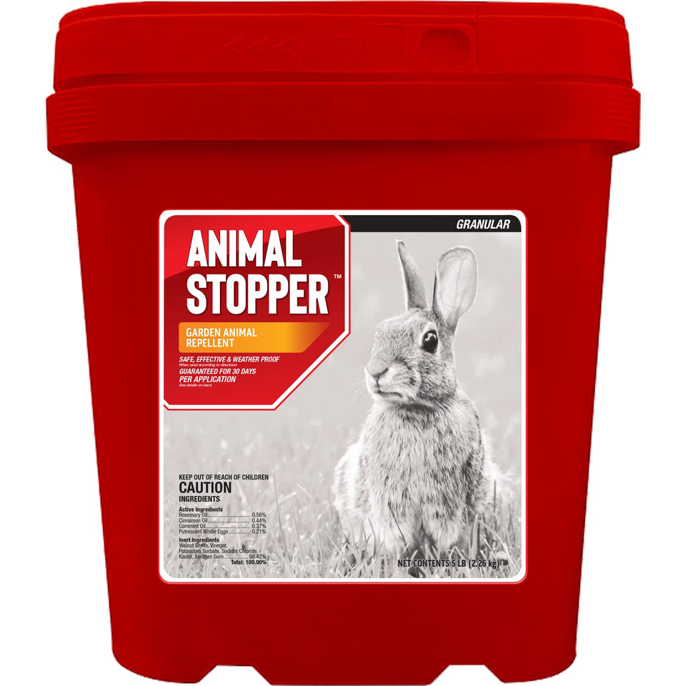 Messinas Animal Stopper Granular being poured to protect a garden bed from pests