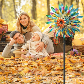 MeyRolizn wind spinner mounted in a garden setting provides vibrant outdoor decor.