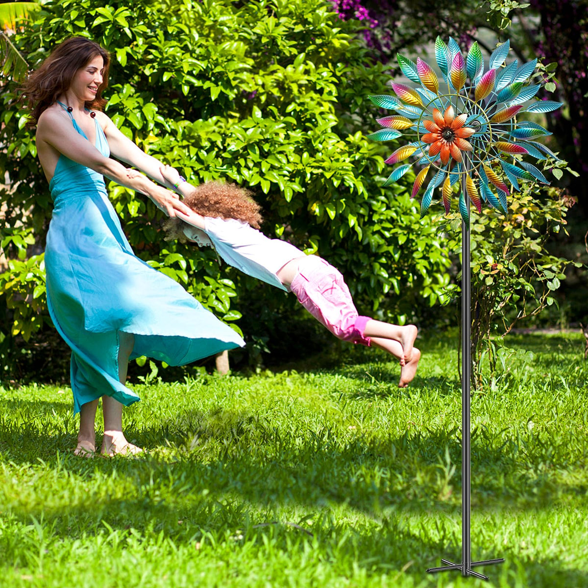 MeyRolizn wind spinner in motion demonstrates serene garden ambience.