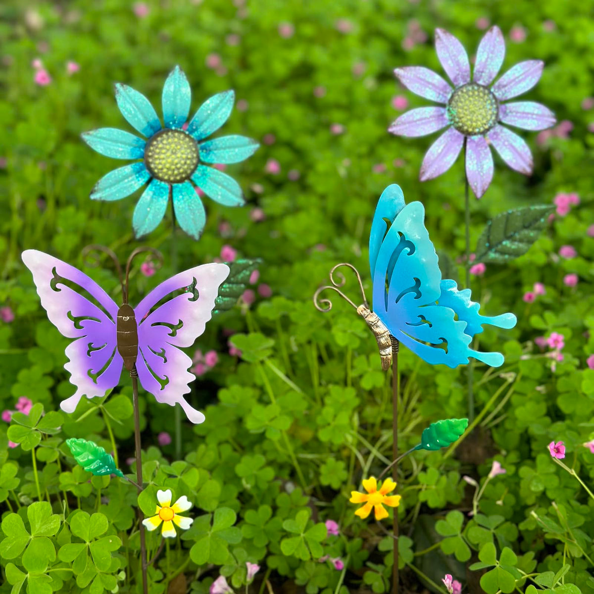 MGSYPHOME four-pack garden stakes showcase detailed metal workmanship for outdoor displays.