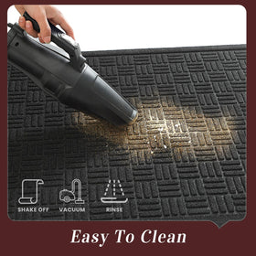 Mat being vacuumed to demonstrate easy cleaning.