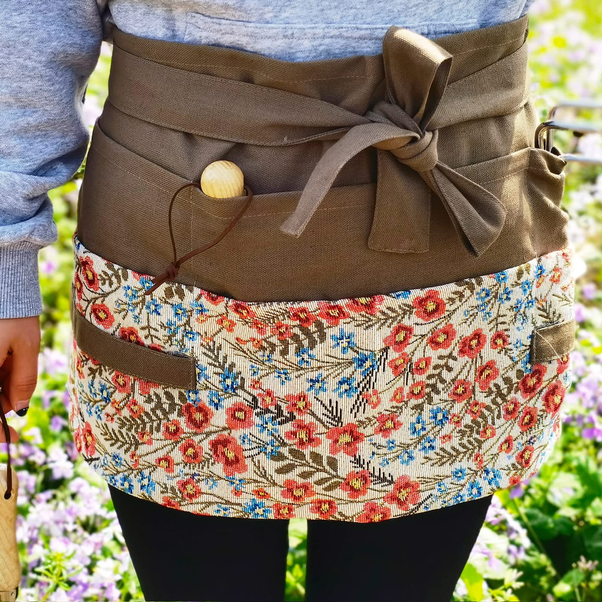 MILCIL apron side pocket view showing eight tool pockets for organization