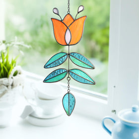 MintyWiz Coral Tulip Suncatcher in sunlight casting colorful patterns