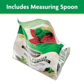 Miracle-Gro garden feeder pouring solution to nourish plants