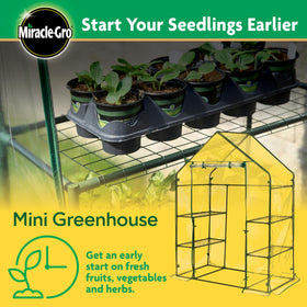 Miracle-Gro Mini Walk-In Greenhouse side view, sturdy steel frame for outdoor durability.