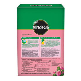 Dissolving Miracle-Gro Rose Plant Food in water for quick feeding.