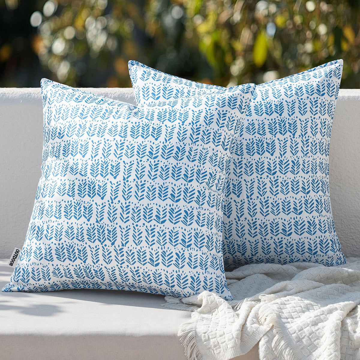 MIULEE outdoor pillows set two in dark blue on a stylish patio for durable comfort.