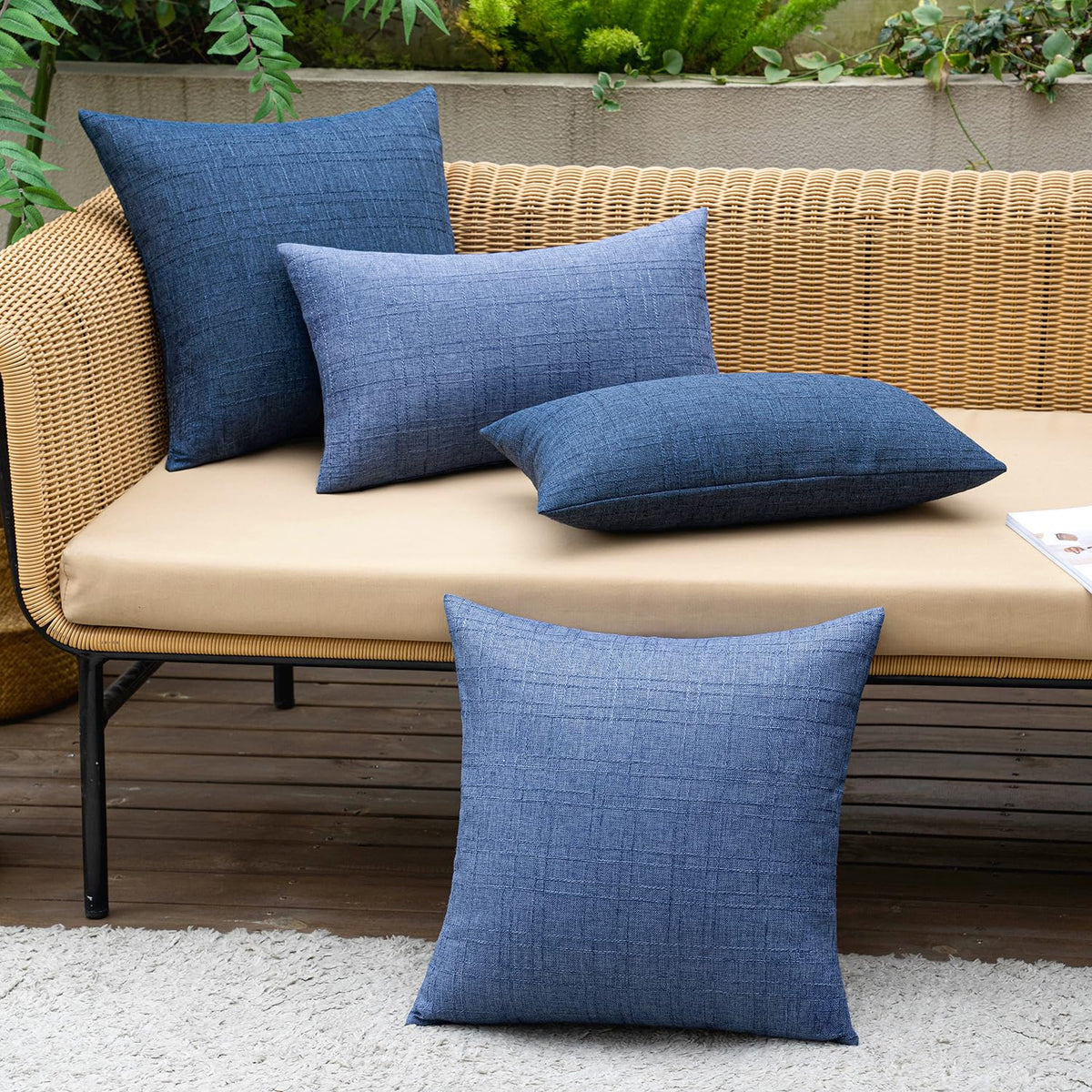 MIULEE patio garden setup featuring navy pillow covers.