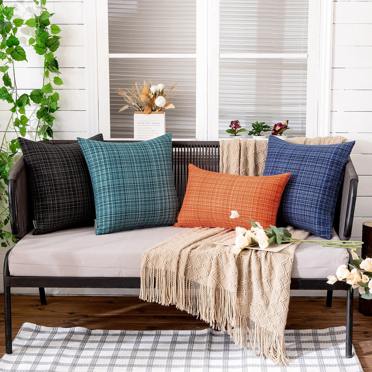 MIULEE teal cushion cover used in garden setting offers versatile indoor-outdoor style.