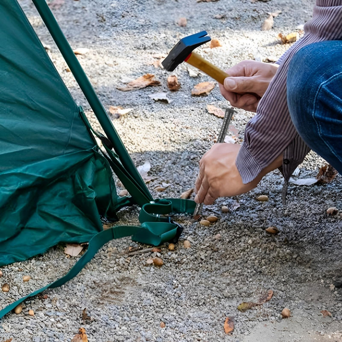 MIVIDE ground anchors supporting garden plants like trees and shrubs.