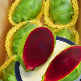 Display of Mixrug dragon fruit harvest with vibrant, ready-to-serve fruit.