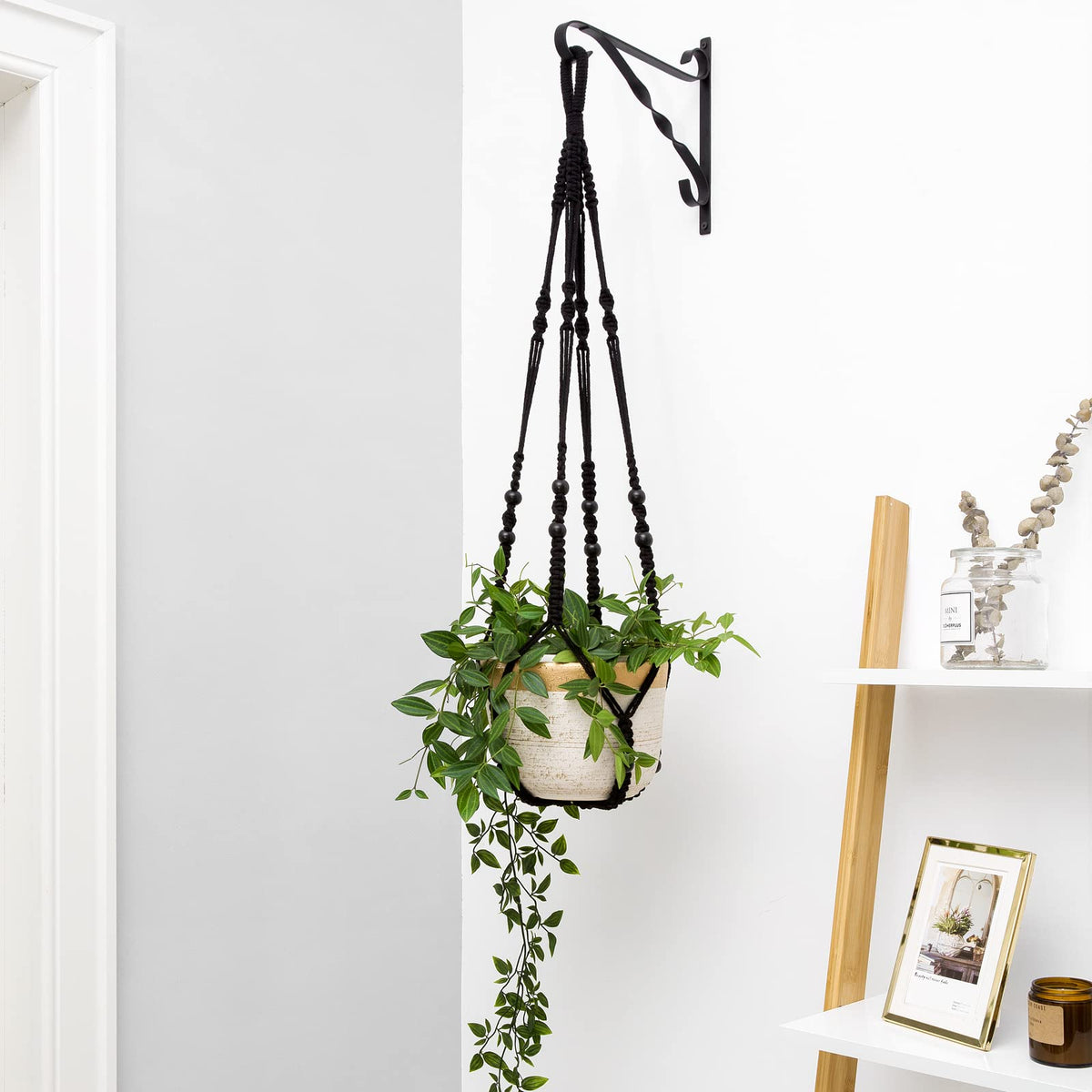Black Mkono hanger suitable for indoor or outdoor use in any corner