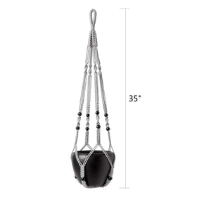 Grey Mkono hanger with wood beads enhances boho home decor.