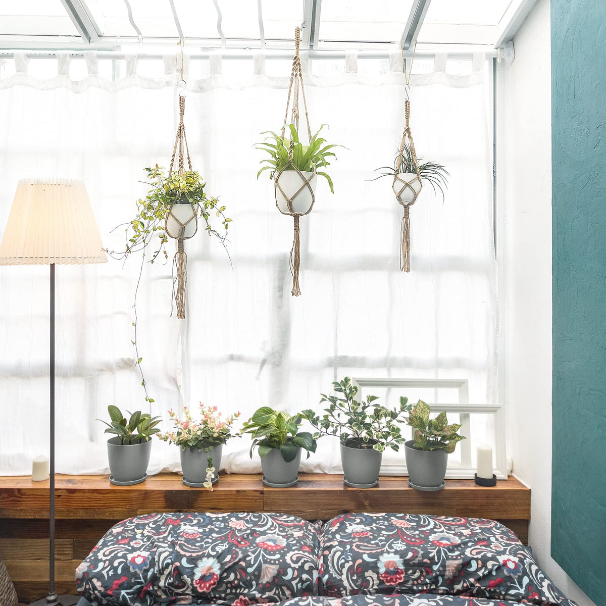 Mkono macrame hanger in living room adds greenery and cozy style.