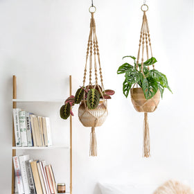 Mkono macrame plant holder made from natural jute for boho indoor decor.