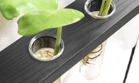 Mkono minimalist wooden frame with tubes creates elegant home garden decor.