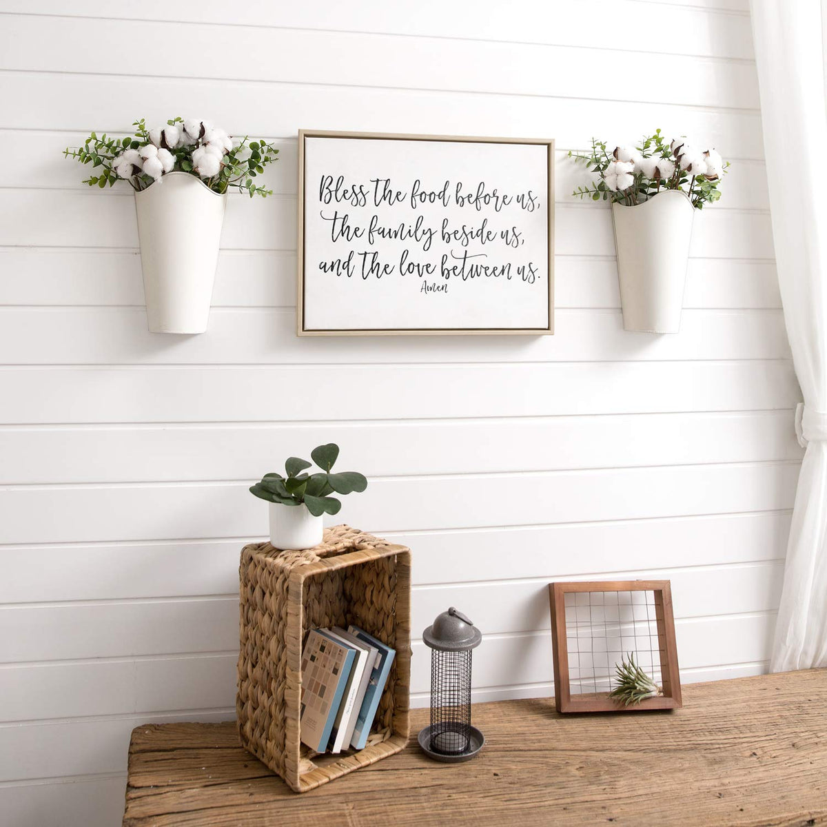 Mkono rustic metal planter displaying faux flowers and eucalyptus stems.