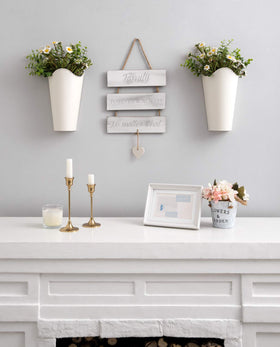 Mkono wall vase with antique finish designed to hang above a headboard.