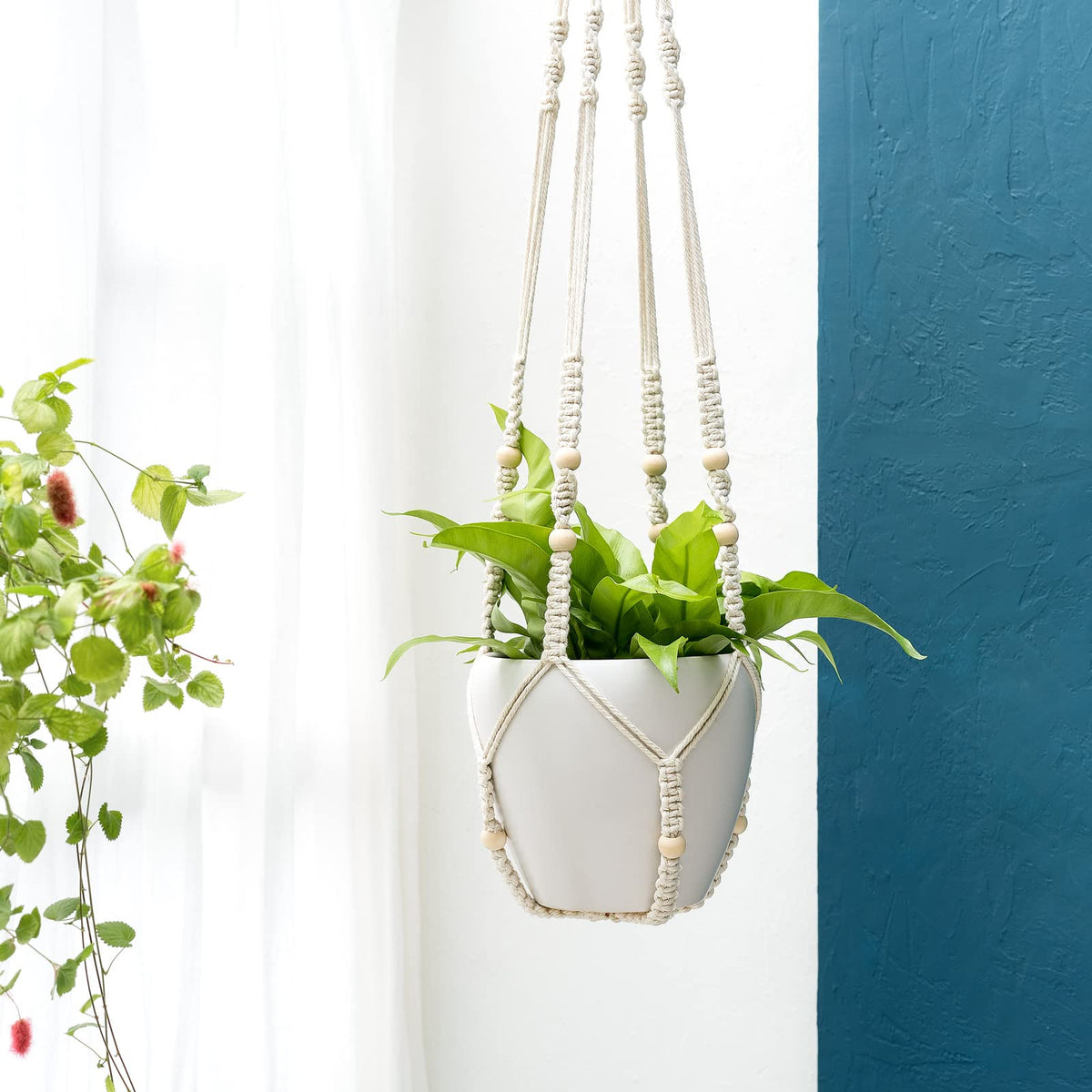 Mkono wood bead accent macrame hanger adds warm texture to outdoor spaces