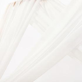 MLMC Ivory white wedding arch drapes create a light, sheer photo backdrop.