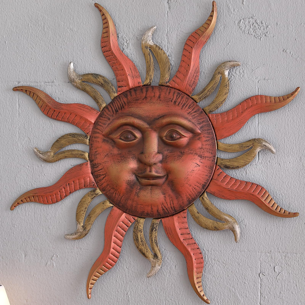 MOCOME sun face metal art with a bright smile enhances indoor ambiance.