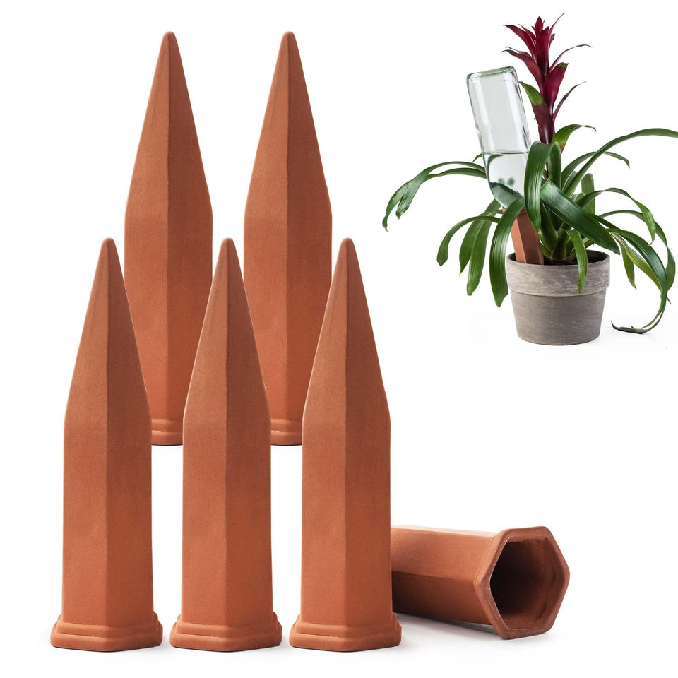 Modern Innovations ceramic terracotta self-watering spike beside a thriving plant for steady moisture