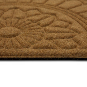Mohawk Home recycled rubber backing supports durable outdoor use.