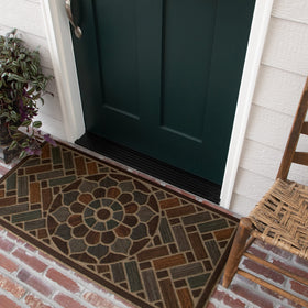 Mohawk Home doormat textured surface close-up shows grooved dirt removal.