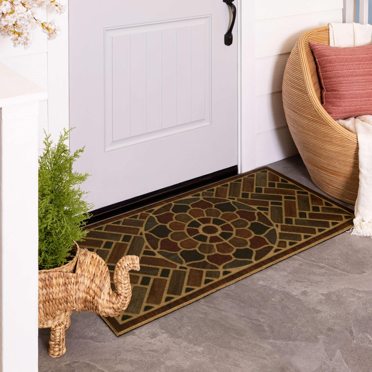 Mohawk Home medallion grain mat channels water away from shoes.