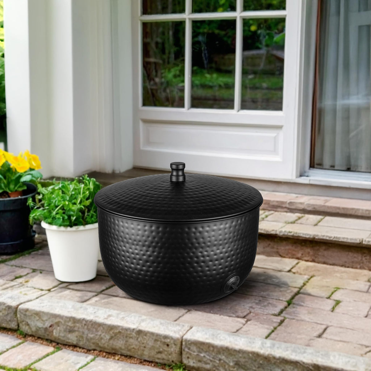 Hand hammered finish Monarch Abode garden hose pot adds durability and style.
