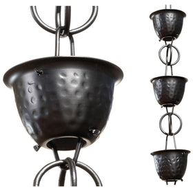 Monarch Rain Chains aluminum hammered cup black rain chain displayed outdoors as a gutter alternative.