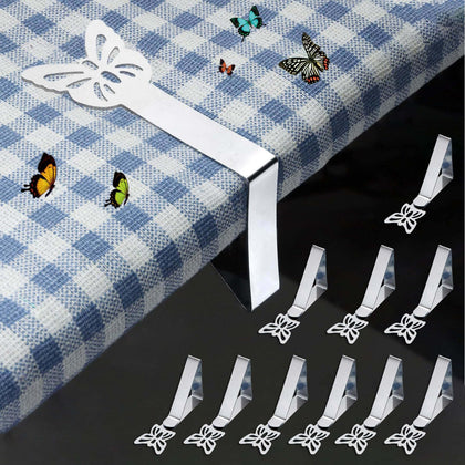 MONNCHA butterfly tablecloth clip in use secures a cloth on a windy outdoor table