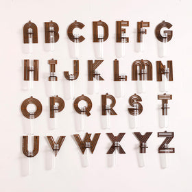 Monsefi minimalist wood letter design complements modern interior decor.