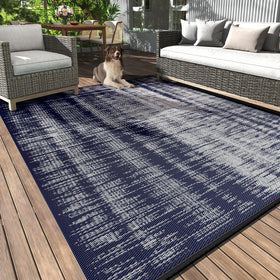 MontVoo 8x10 waterproof outdoor rug on a sunlit patio, all-weather ready.