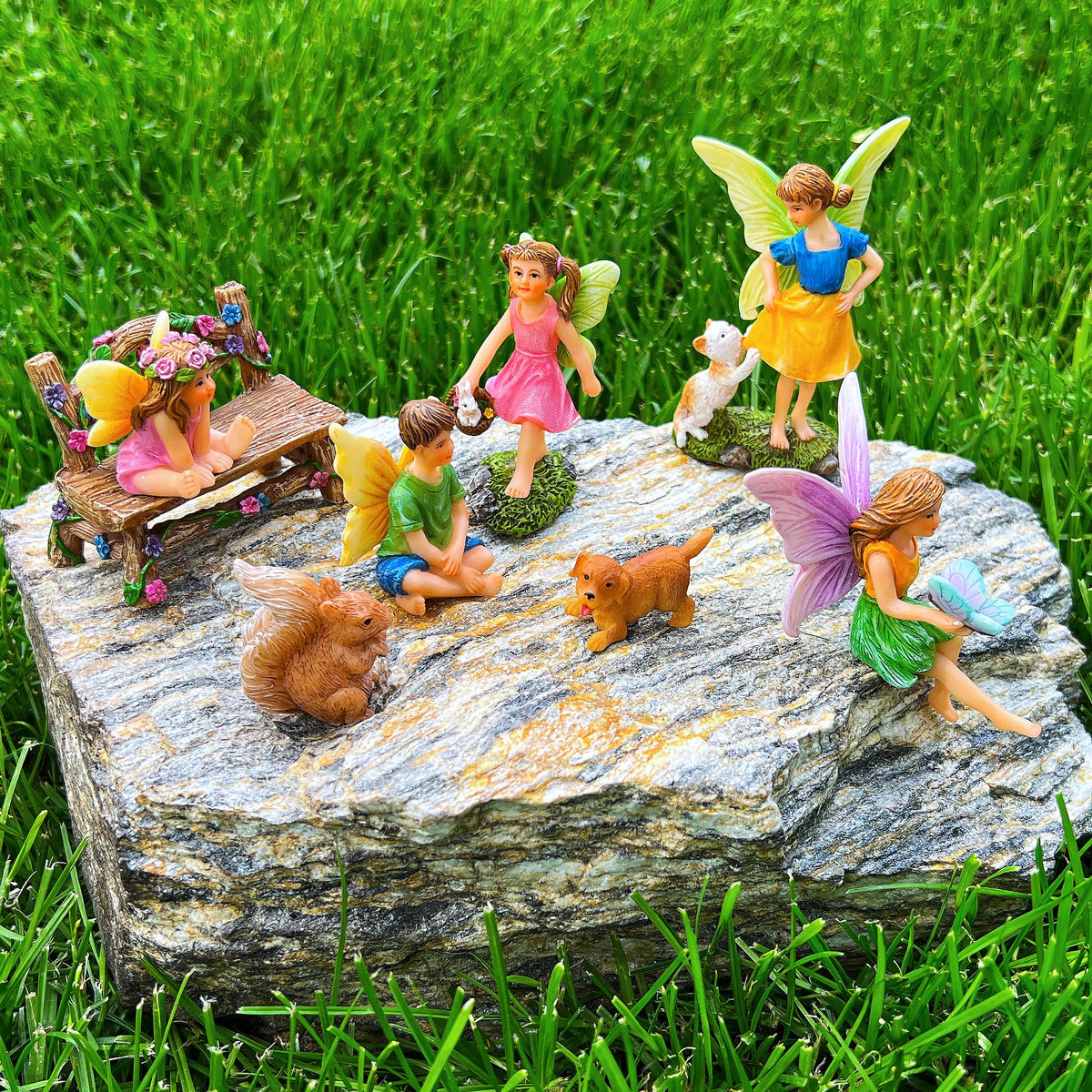 Hand-painted resin figurines withstand sun and rain for year-round display.