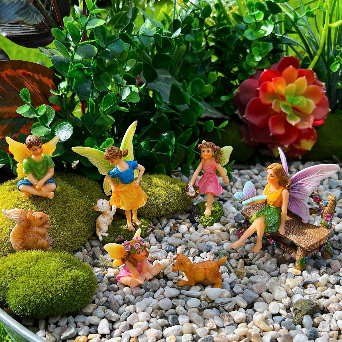 Collections-friendly figures pair with plants, stones, and fairy lighting.
