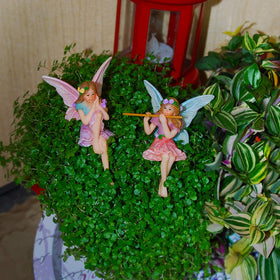 Mood Lab sitting fairies nestle beside plants for charming terrarium accents.