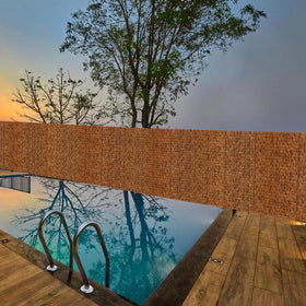 MOOKNAT natural material complements outdoor restaurant and hotel settings.