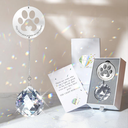 Mooncraftlogy crystal ball prism casts rainbow light for pet remembrance.